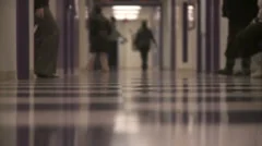 Students walking in school hallway (slo-mo)
