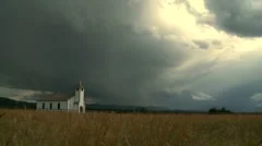 Country church with storm clouds