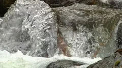 dancing mosiac of water rushing over wood and stone (audio included)