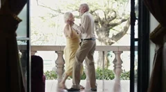 Senior married couple dancing outdoor