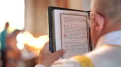 priest reading Bible