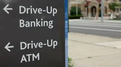 Drive up bank and ATM sign by Street
