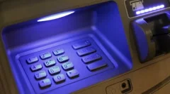 Placing card into ATM and putting in pin