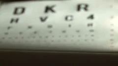 Eye test and black eyeglasses in front