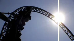 Theme Park Amusements - Looping Roller Coaster Ride - Backlit Sun HD