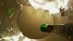 Pour champagne into a wine glass