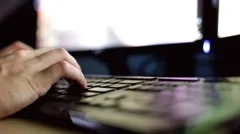 Fingers typing at desktop computer keyboard