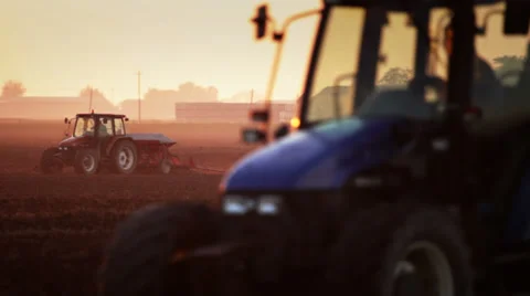 0087 Three tractors at work in a farm land Stock Footage 30824053