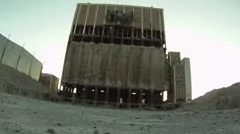 Building implosion danger close. Collapse and dust cloud blackout camera