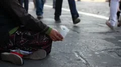 Woman homeless in city begging
