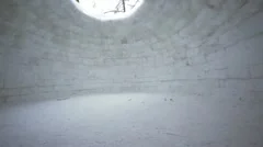 Inside empty house of ice, eskimo igloo, trees visible through hole in roof
