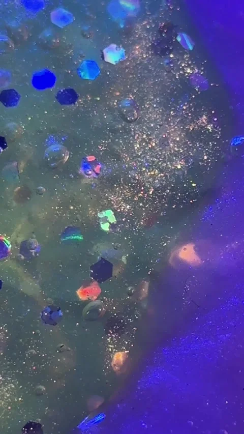 009_Colorful glitter texture with bubbles.mp4 Stock Footage 342546269