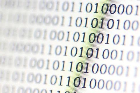 0,1, binary code on led computer monitor Stock Photos