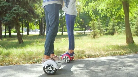 01 Couple rides hoverboard Stock Footage 74691204