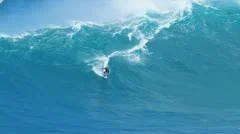 surfer riding gaint wave