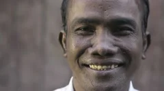 Portrait of Asian man smiling and looking at camera
