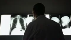 Doctor working in hospital during examination of x-rays