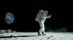 SLO MO, WS lockdown of an astronaut doing the moonwalk and dancing on the moon