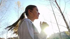 Girl runs through the park in the morning slow motion