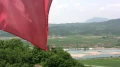 Glimpses of North Korea behind a red flag