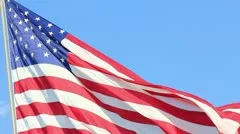 closeup of jumbo american flag against a blue sky - hd - 1920x1080