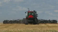 Agriculture, tractor and seeder planting canola, spring long head on, #1