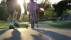 Excited Father Helps Daughter Ride Her New Bike Up Hill