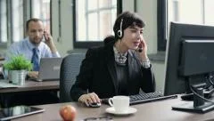 Friendly happy female helpdesk consultant in the office HD