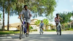 Healthy Ethnic Family Bike Riding Together