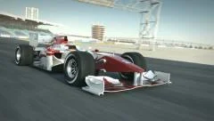 formula one race car on desert circuit passing camera