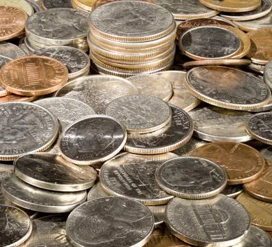 Macro image in deep focus of a pile of USA currency coins in stacks ...
