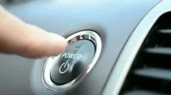 Pushing a power button in modern hybrid car