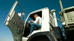 Truck Driver in Cab Using Mobile Phone