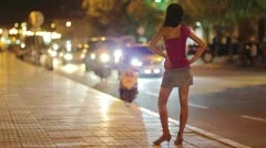 prostitute waiting for costumer on street at night
