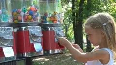 Child Buying a Ball Toy from Vending Machine, Little Girl in Park, Children