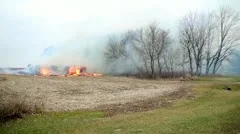 stack of hay/bales on fire