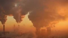 Polluting factory at dawn