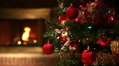 Decorated Christmas Tree with Focus Changing to Fireplace in Background