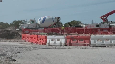 0167Construction Site With Cemex Cement Mixer Truck, Safety Fencing, And Worker Stock Footage 325535747