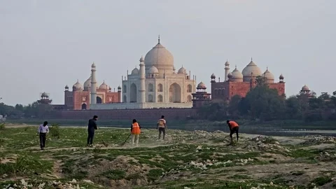 02-29-24, UP; Cleaning the River Yamuna and Taj Mahal Glow Stock Footage 266289755