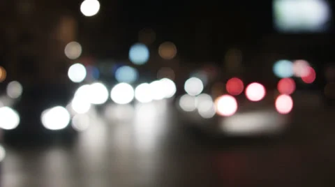 0200 Traffic. Defocused car lights,at a crossroad in town Stock Footage 33644364