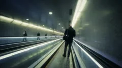 Silhouette of man on moving sidewalk