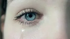 crying girl with tears in her beautiful eyes in 1080p close up