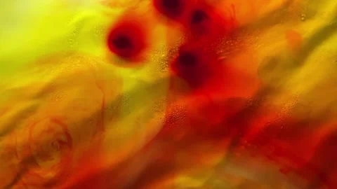 020_Red ink dissolving in yellow liquid.mp4 Stock Footage 345074002