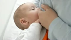 mother feeding baby