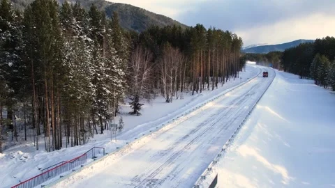 022 A truck driving by the snow road Stock Footage 166344312