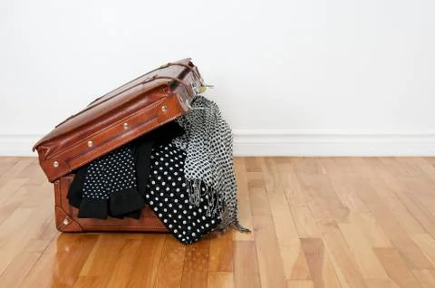 Black  and  white  polka  dot  clothes  in  a  retro  leather  suitcase. xkwx antique,  apparel,  bag,  baggage,  black,  brown,  classic,  clothes,  clothing,  colour,  copy  space,  dotted,  excess,  fabric,  fashion,  floor,  full,  garment,  hardwood,  holiday,  journey,  leather,  luggage,  old,  old  fashioned,  old-fashioned,  open,  overfilled,  packed,  parquet,  polka  dot,  retro,  room,  space  for  text,  style,  stylish,  suitcase,  textile,  too  many,  too  much,  travel,  trip,  vacation,  vintage,  wall,  wear,  white,  wooden