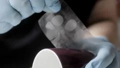 Police CSI lifting fingerprints at crime scene