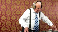 very funky elderly grandpa dj mixing records
