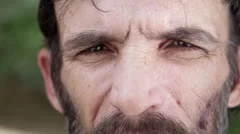 Portrait of sad adult hispanic man with beard, close up